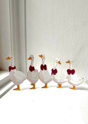 Weihnachtspapierausschnitte Gänse in einer Reihe